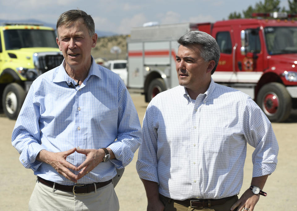 Then Colorado Governor John Hickenlooper and U.S. Senator Cory Gardner discuss the Spring Fire during a press conference at the Sierra Grande School grounds in Fort Garland, July 5, 2018.  / Credit: Andy Cross/The Denver Post via Getty Images