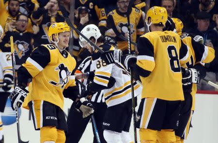 Dec 14, 2018; Pittsburgh, PA, USA; Pittsburgh Penguins left wing Jake Guentzel (59) reacts with teammates after scoring a goal against the Boston Bruins during the third period at PPG PAINTS Arena. The Penguins won 5-3. Mandatory Credit: Charles LeClaire-USA TODAY Sports