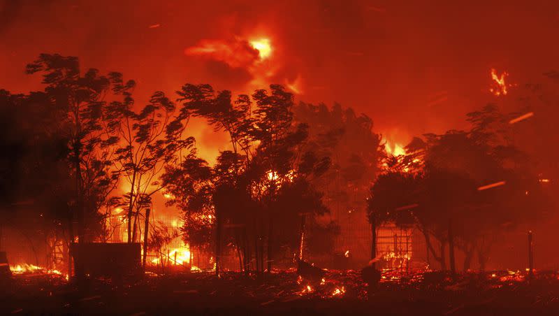 A wildfire burns a house in Avantas village, near Alexandroupolis town, in the northeastern Evros region, Greece, Monday, Aug. 21, 2023. Gale-force winds are fanning the flames of wildfires across Greece, including 53 new blazes that broke out early Monday amid hot, dry and windy weather that has sucked moisture from vegetation.