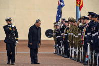 Chinese Premier Li Qiang inspects a guard of honor outside Parliament House in Canberra, Australia, Monday, June 17, 2024. Li, Australian Prime Minister Anthony Albanese and senior ministers of both administrations met at Parliament House on Monday to discuss thorny issues, including lingering trade barriers, conflict between their militaries in international waters and China's desire to invest in critical minerals. (Lukas Coch/Pool Photo via AP)