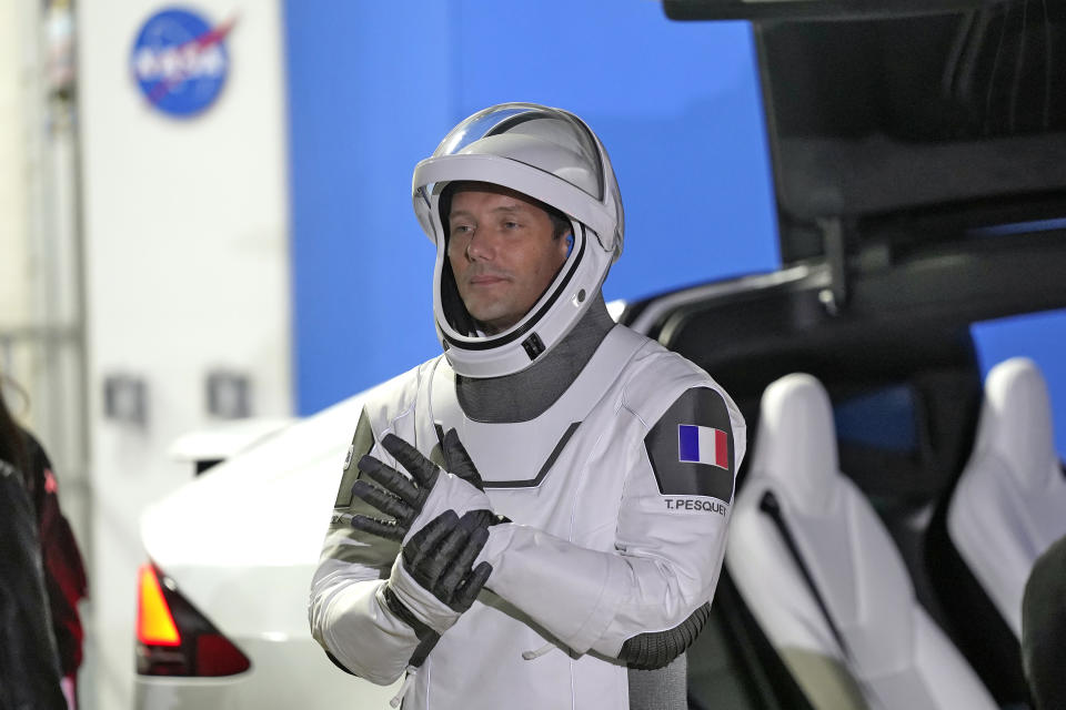 European Space Agency astronaut Thomas Pesquet of France, adjusts his glove as he talks to family and friends before a launch attempt Friday, April 23, 2021, at the Kennedy Space Center in Cape Canaveral, Fla. Four astronauts will fly on the SpaceX Crew mission to the International Space Station scheduled for launch on April 23, 2021. (AP Photo/John Raoux)