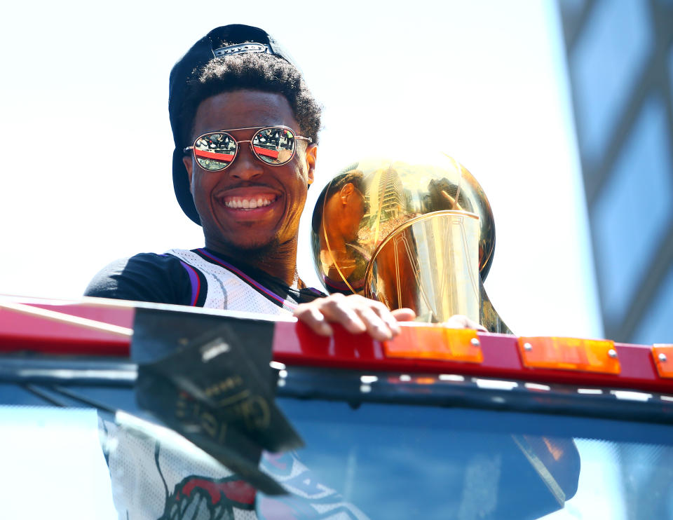 TORONTO, ON - JUNE 17:  Kyle Lowry #7 of the Toronto Raptors holds the championship trophy during the Toronto Raptors Victory Parade on June 17, 2019 in Toronto, Canada. The Toronto Raptors beat the Golden State Warriors 4-2 to win the 2019 NBA Finals.  NOTE TO USER: User expressly acknowledges and agrees that, by downloading and or using this photograph, User is consenting to the terms and conditions of the Getty Images License Agreement.  (Photo by Vaughn Ridley/Getty Images)