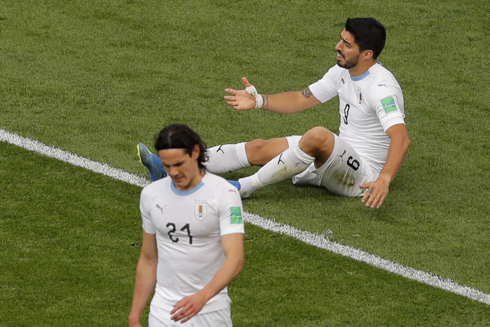 Uruguay’s Luis Suarez, top, reacts after failing to score next to Uruguay’s Edinson Cavani during the group A match between Egypt and Uruguay at the 2018 soccer World Cup in the Yekaterinburg Arena in Yekaterinburg, Russia, Friday, June 15, 2018. (AP Photo/Vadim Ghirda)