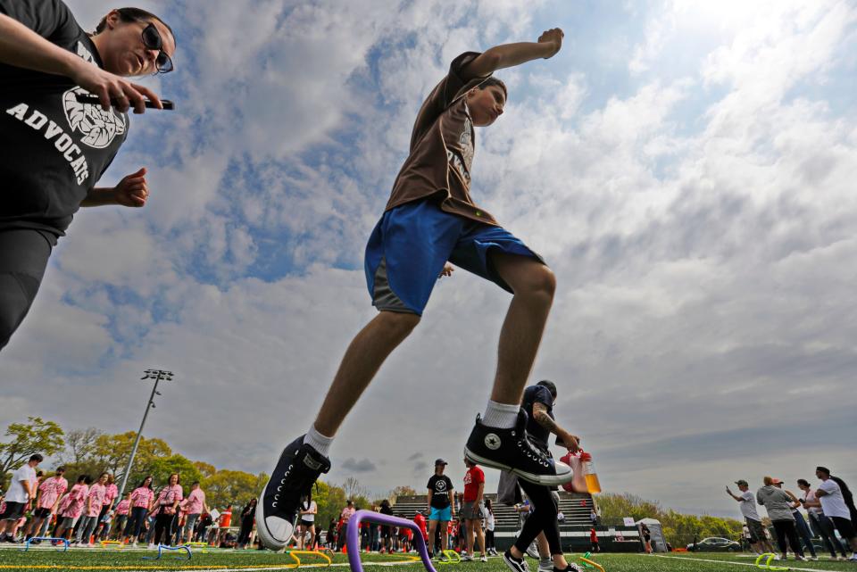 Ricky Pacheco clears the hurdle during the Special Olympics held at Memorial Stadium in Dartmouth.