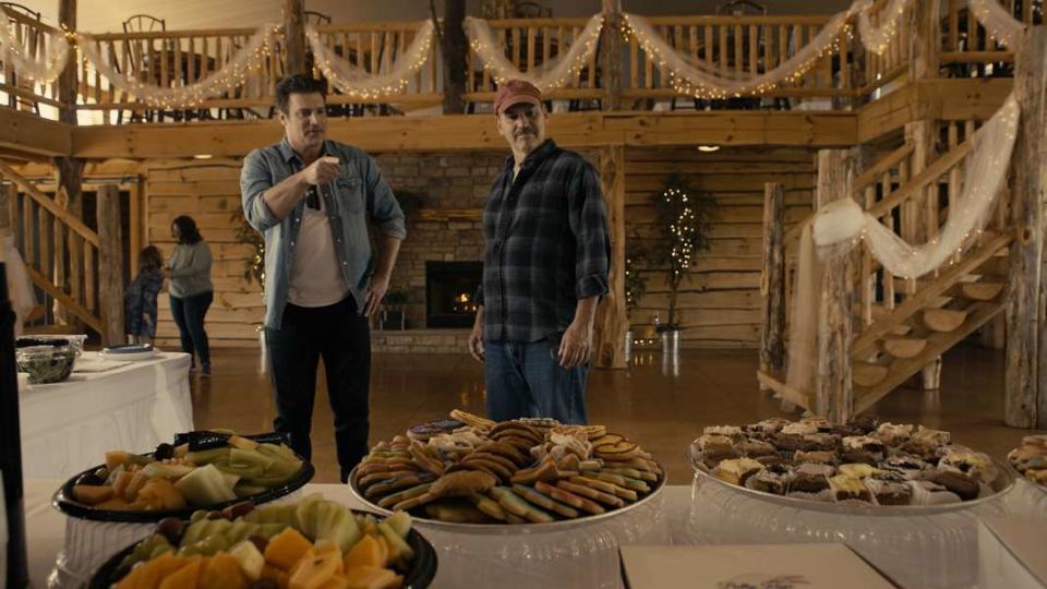 Houston Rhines, left, and Duffy Hudson appear in a scene from the film "The Green Oak Guardian." The food items on the table came from the Betty Kaye Bakery in Carrollton.