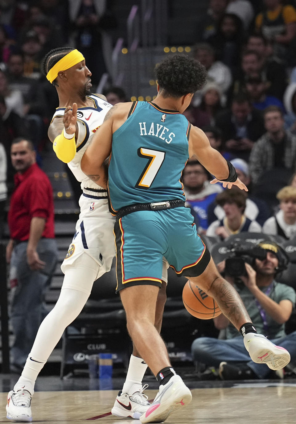 Detroit Pistons guard Killian Hayes (7) runs into Denver Nuggets guard Kentavious Caldwell-Pope (5) during the third quarter of an NBA basketball game, Tuesday, Nov. 22, 2022, in Denver. (AP Photo/Jack Dempsey)