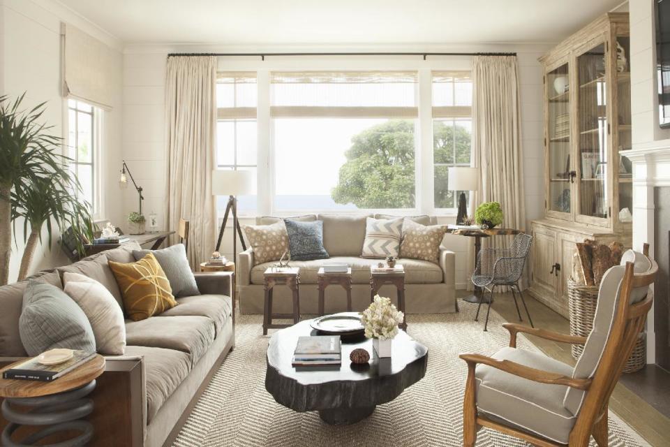 This interior design image released by Lucas Studio, Inc. shows a living room. The sun-drenched colors and windswept beachfront textures of summer provide ample inspiration for indoor decorating. Done wrong, a summer-inspired interior can be a tacky, overly tropical disaster. But with a light touch and careful choices, summer can provide ideas for an interior you'll love all year long. (AP Photo/Lucas Studio, Inc., Karyn Millet)