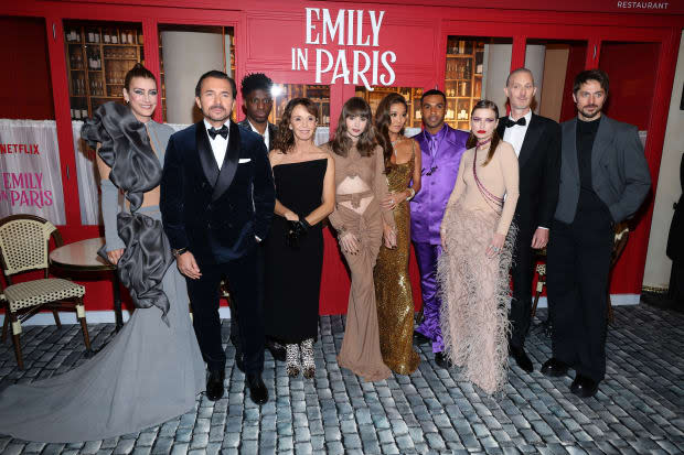 PARIS, FRANCE - DECEMBER 06: (Left to Right) Kate Walsh, William Abadie, Samuel Arnold, Philippine Leroy-Beaulieu, Lily Collins, Ashley Park, Lucien Laviscount, Camille Razat, Bruno Gouery, and Lucas Bravo<p><a href="https://www.gettyimages.com/detail/1447259629" rel="nofollow noopener" target="_blank" data-ylk="slk:Pascal Le Segretain/Getty Images;elm:context_link;itc:0;sec:content-canvas" class="link ">Pascal Le Segretain/Getty Images</a></p>