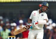 Cricket - India v New Zealand - Third Test cricket match - Holkar Cricket Stadium, Indore, India - 08/10/2016. India's Cheteshwar Pujara avoids a bouncer. REUTERS/Danish Siddiqui