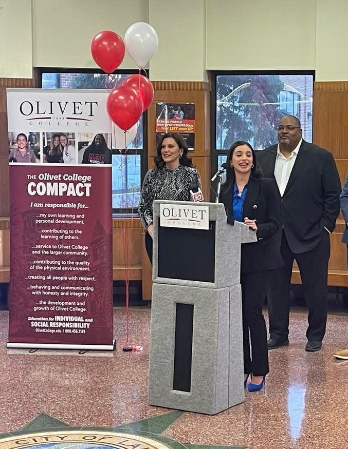 Emma Marie Asaf, a 2019 J.W. Sexton High School graduate and a senior at Olivet College, speaks following the announcement of the Olivet College ADVANTAGE Scholarship on Thursday, Dec. 8, 2022 at J.W. Sexton High School in Lansing. She is flanked by Gov. Gretchen Whitmer and Sexton Principal Dan Boggan.