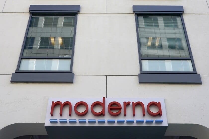 FILE - In this Dec. 15, 2020, file photo, a sign for Moderna, Inc. hangs on its headquarters in Cambridge, Mass. Moderna's experimental COVID-19 vaccine that combines its original shot with protection against the omicron variant appears to work, the company announced Wednesday, June 8, 2022. COVID-19 vaccine makers are studying updated boosters that might be offered in the fall to better protect people against future coronavirus surges.(AP Photo/Elise Amendola, File)