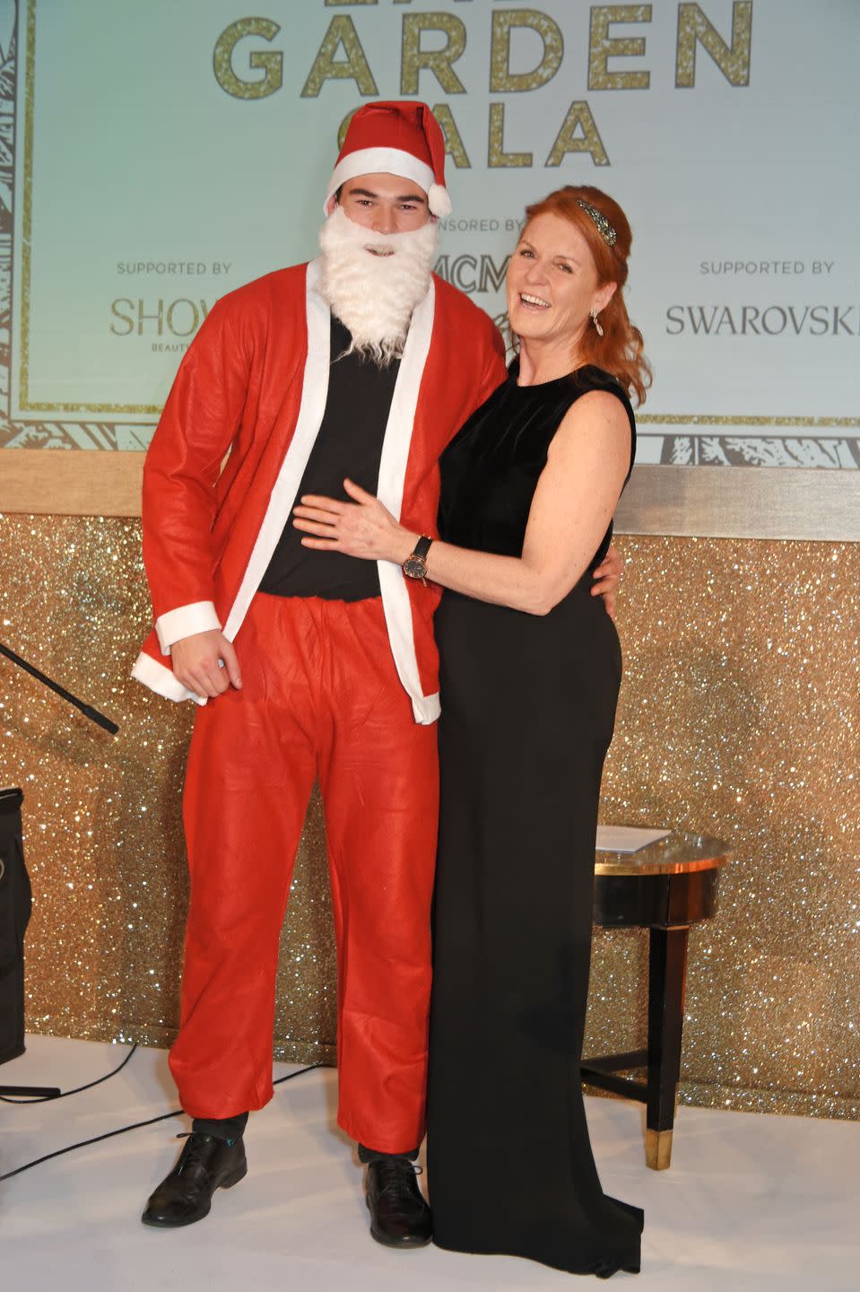 <p>Sarah Ferguson with Santa Claus at the Lady Garden Gala at Claridge's Hotel.</p>