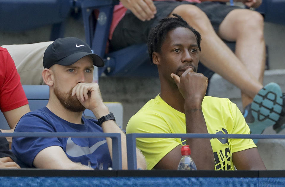 Gael Monfils, of France, right, watches a match between Elina Svitolina, of Ukraine, and Johanna Konta, of the United Kingdom, during the quarterfinals of the US Open tennis championships Tuesday, Sept. 3, 2019, in New York. (AP Photo/Frank Franklin II)