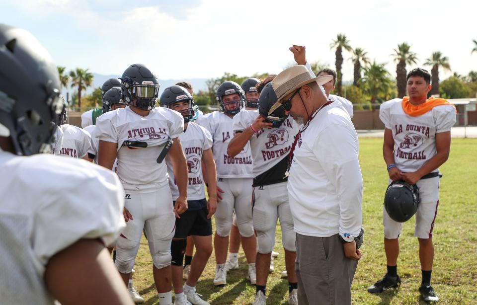 Head coach Juan Ruiz goes through hand signals with his team as the Blackhawks practice for the upcoming 2023 season Tuesday morning in La Quinta, Calif., August 8, 2023. 