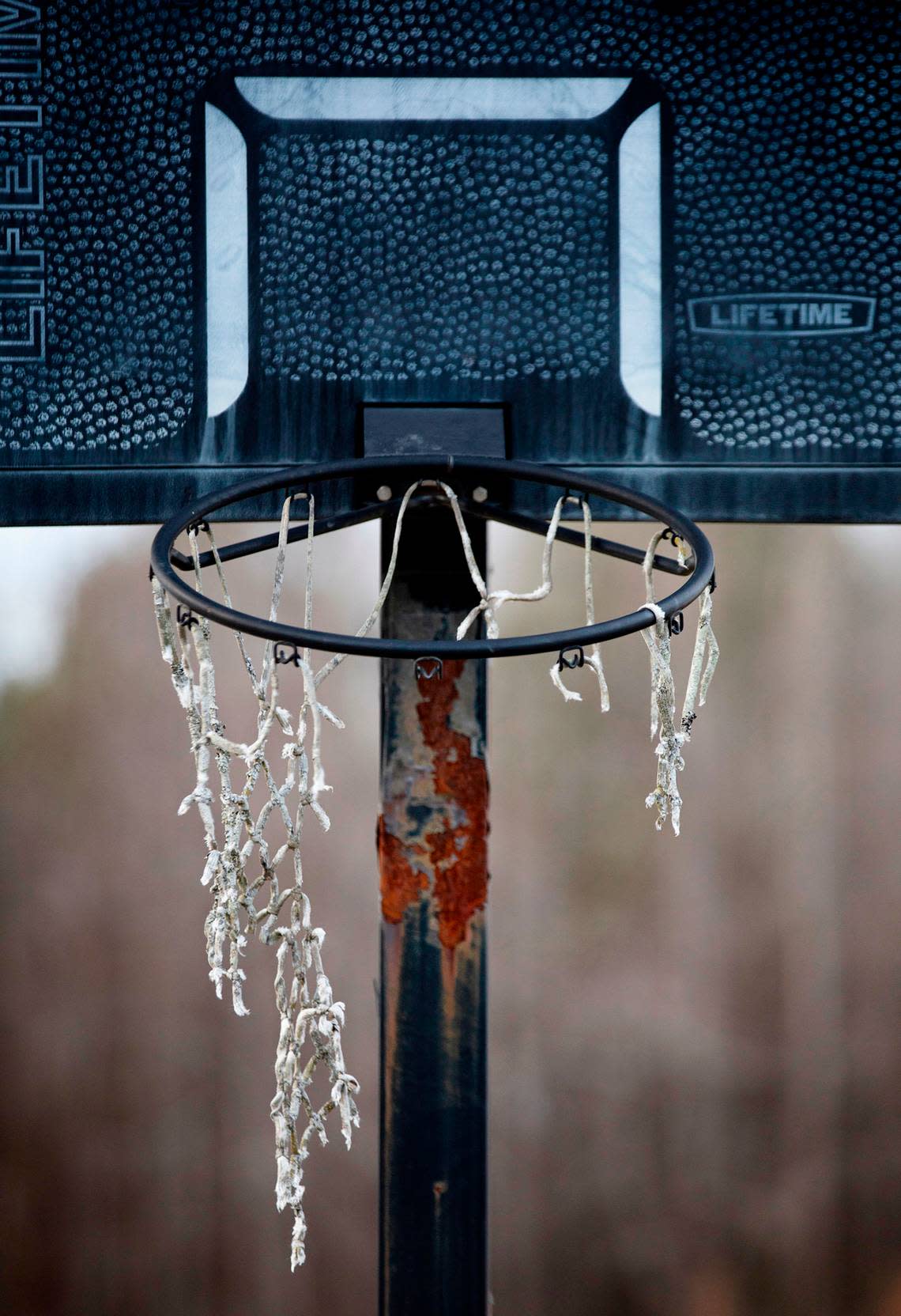 A frayed net hangs from the rusting rim of a basketball hoop just east of Raleigh in an area previously known for tobacco farming that is giving way to subdivisions. Scott Sharpe/ssharpe@newsobserver.com