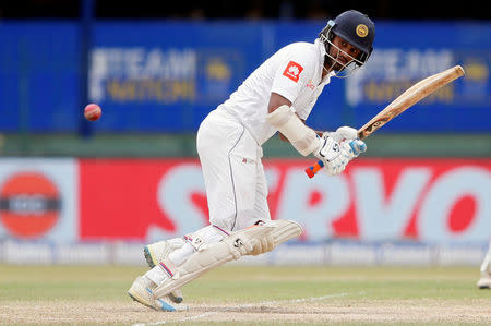 Cricket - Sri Lanka v India - Second Test Match - Colombo, Sri Lanka - August 6, 2017 Sri Lanka's Dimuth Karunaratne hits a boundary. REUTERS/Dinuka Liyanawatte/Files