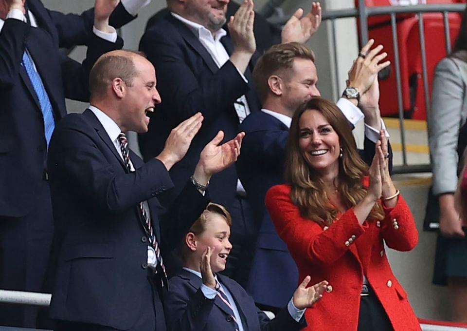 British Prince William, Duke of Cambridge, his wife Kate, Duchess of Cambridge, and their eldest son Prince George attend the Euro 2020 soccer match round of 16 between England and Germany at Wembley stadium in London, Tuesday, June 29, 2021. - Credit: AP