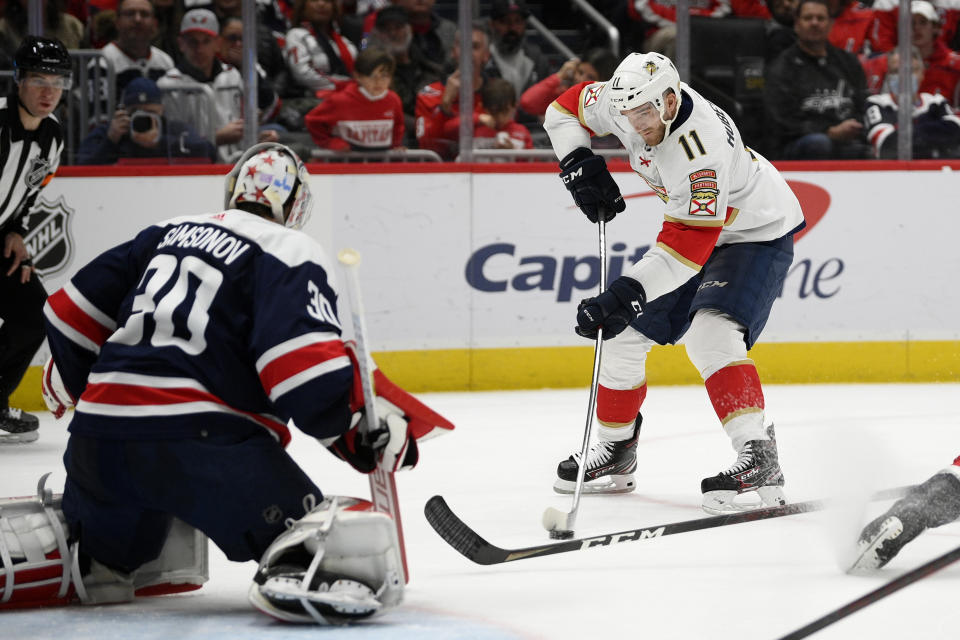 Florida Panthers left wing Jonathan Huberdeau (11) skates with the puck against Washington Capitals goaltender Ilya Samsonov (30) during the second period of an NHL hockey game, Friday, Nov. 26, 2021, in Washington. (AP Photo/Nick Wass)