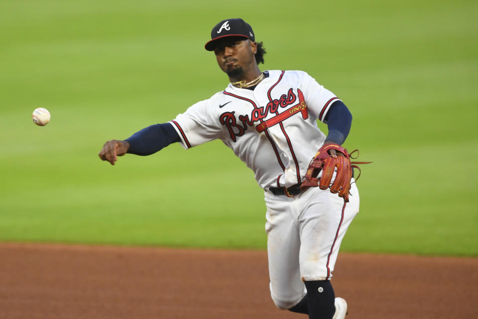 Atlanta Braves second baseman Ozzie Albies Tampa Bay Rays' Joey Wendle at first base during the sixth inning of a baseball game Thursday, July 30, 2020 in Atlanta. (AP Photo/John Amis)