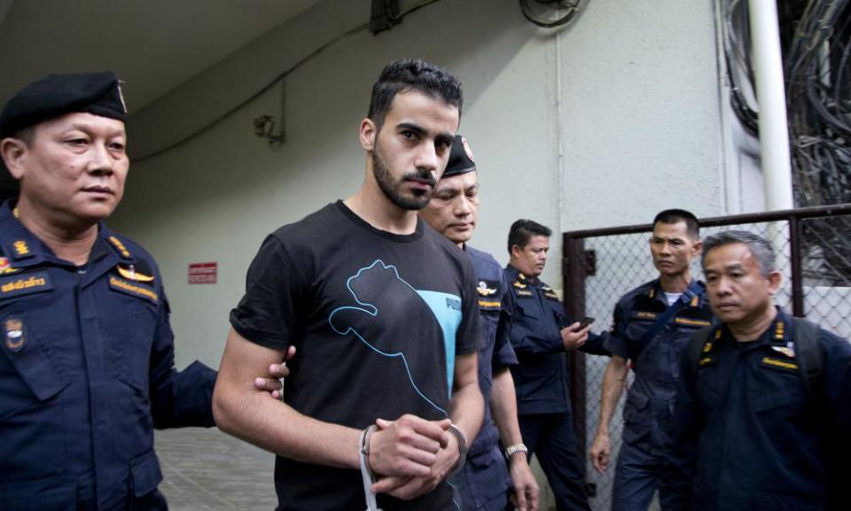 Thai prison guards lead football player Hakeem Al-Araibi, from a court house in Bangkok.