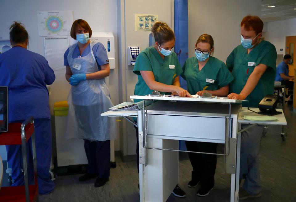 Medical staff wearing protective face masks work in the Critical Care Unit at the Royal Blackburn Teaching Hospital in Blackburn, north-west England on May 14, 2020, as national health service (NHS) staff in Britain fight the novel coronavirus COVID-19 pandemic. (Photo by HANNAH MCKAY / POOL / AFP) (Photo by HANNAH MCKAY/POOL/AFP via Getty Images)