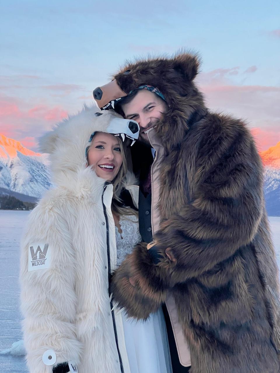 A bride and groom in matching bear coats