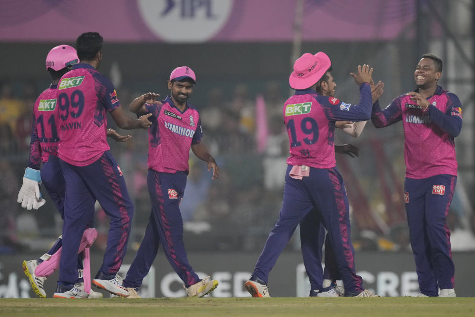 Rajasthan Royals players celebrates the dismissal of Delhi Capitals Rovman Powell during the Indian Premier League (IPL) cricket match between Rajasthan Royals and Delhi Capitals in Guwahati, India, Thursday, April 6, 2023. (AP Photo/Anupam Nath)