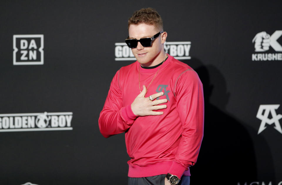Canelo Alvarez motions to the crowd during a ceremonial arrival for an upcoming boxing match Tuesday, Oct. 29, 2019, in Las Vegas. Alvarez is scheduled to fight Sergey Kovalev in a WBO light heavyweight title bout Saturday in Las Vegas. (AP Photo/John Locher)