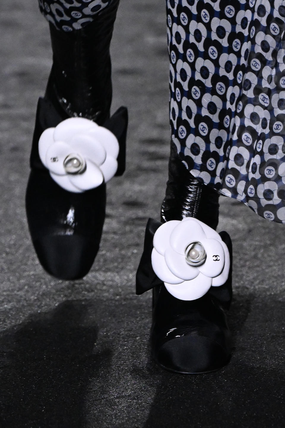 Chanel’s camelia boots for fall winter ’23. - Credit: Corbis via Getty Images