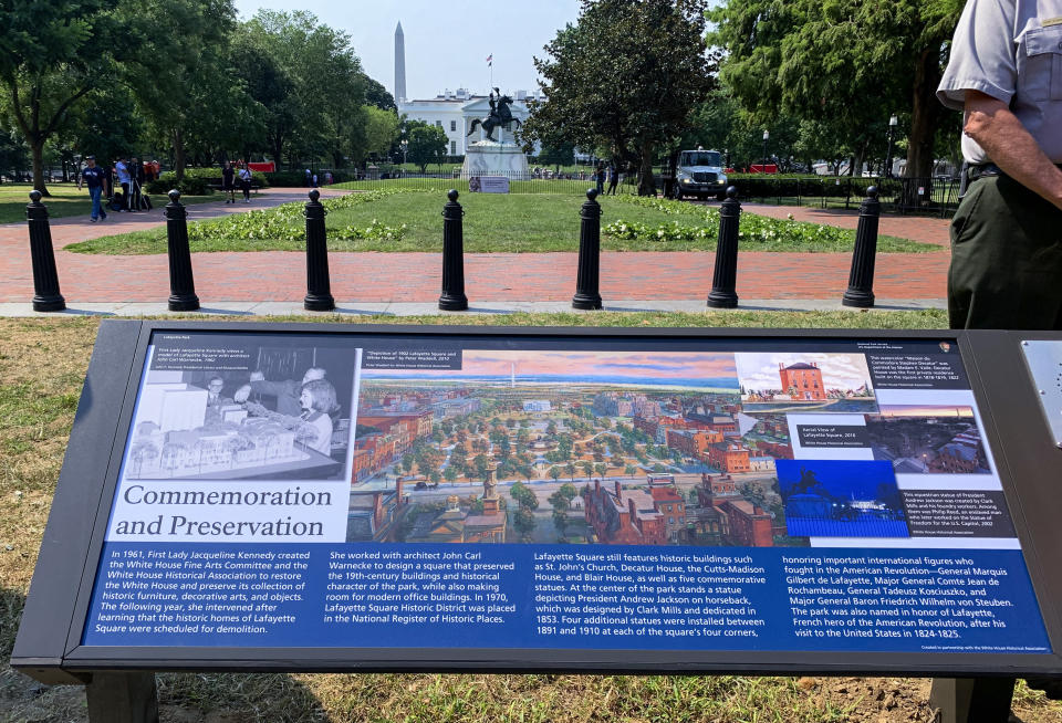 A new historical marker that focuses on former first lady Jacqueline Kennedy, who formed the White House Historical Association in 1961, is displayed at the northern end of Lafayette Park on Wednesday, July 28, 2021, in Washington. The White House Historical Association on Wednesday unveiled three new historical markers at the northern end of Lafayette Park. (AP Photo/Ashraf Khalil)