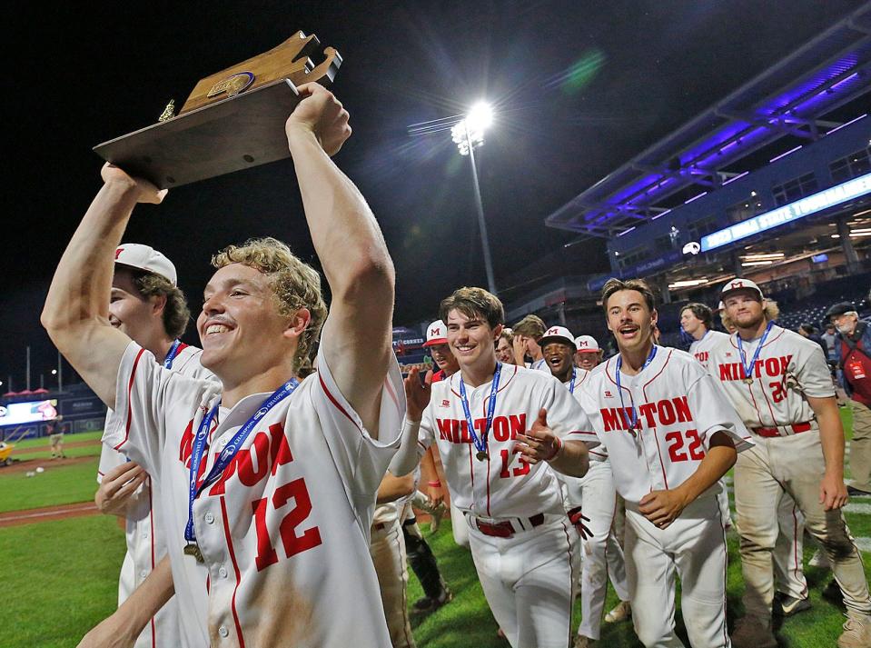 Starting pitcher Owen McHugh leads the team with the state championship trophy.Milton High baseball wins the MIAA State Championship at Polar Park in Worcester on Friday June 16, 2023 