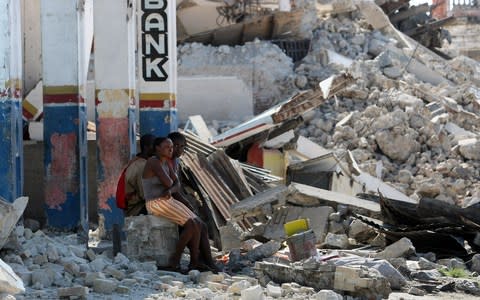 The earthquake devastated the country, sparking a massive international aid effort - Credit: THOMAS COEX/AFP