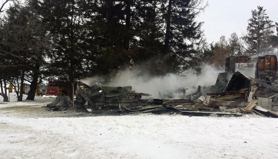 In this photo provided by the Fayette County, Iowa, Sheriff's Office is the scene of a fire that destroyed a house Friday, Jan. 24, 2014 in Arlington, Iowa, and killed at least five, according to authorities. Officials said the property was damaged so badly it may be difficult for officials to collect enough evidence that could shed light on what started the fire. (AP Photo/Fayette County Sheriff's Office)