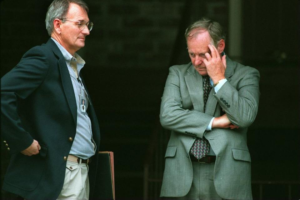 Two of the lead investigators from the FBI in the Centennial Olympic Park bombing case show the strains of the long day spent searching a suspect's apartment. | Jim Davis/The Boston Globe via Getty