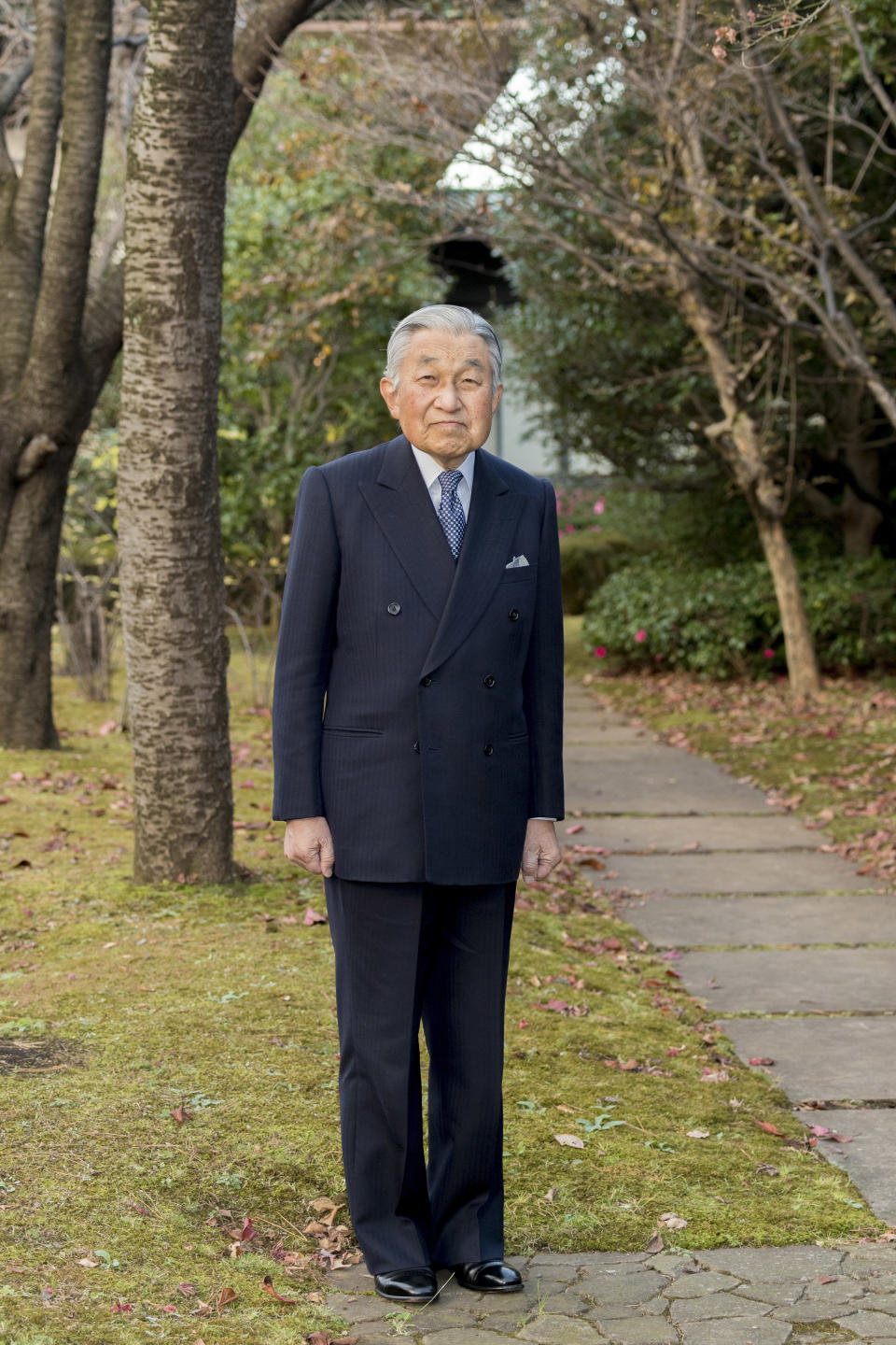 In this Monday, Dec. 10, 2018, photo released on Friday, Dec. 21, 2018, by the Imperial Household Agency of Japan, Japan's Emperor Akihito poses for a photograph at the garden of the Imperial Palace in Tokyo. Emperor Akihito, who turns 85 on Sunday, Dec. 23, and will abdicate this spring, says he feels relieved to see the era of his reign coming to an end without having seen his country at war. (The Imperial Household Agency of Japan via AP)
