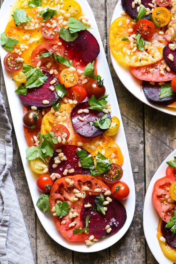 <p>Tomatoes are basically synonymous with summer. If you’re a fan of the fruit, you’re going to be really psyched about this salad.</p> <p>Get the recipe <a href="https://foxeslovelemons.com/heirloom-tomato-beet-salad/" rel="nofollow noopener" target="_blank" data-ylk="slk:here;elm:context_link;itc:0;sec:content-canvas" class="link ">here</a>.</p>