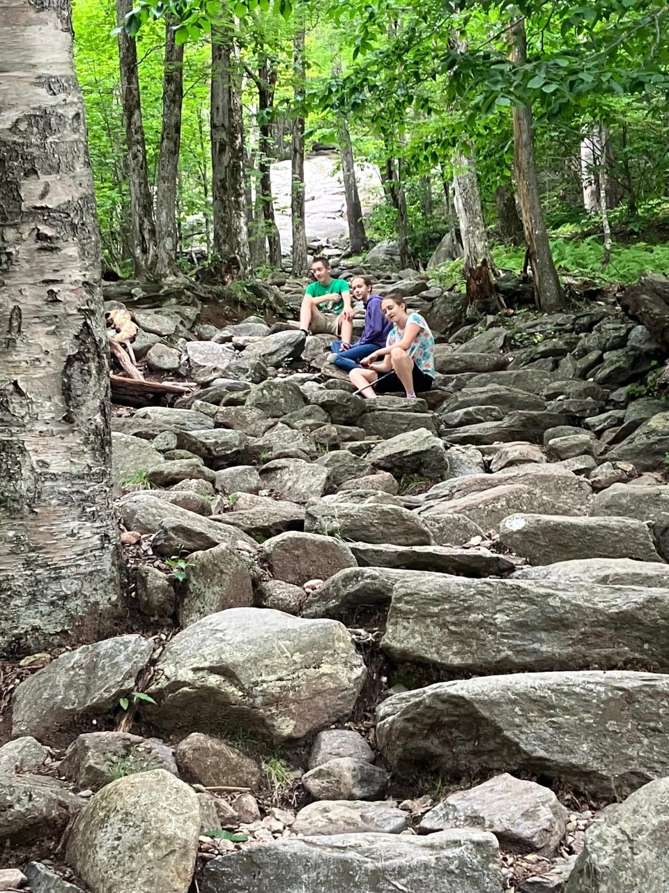 The grandchildren wait on the path for the adults to catch up on the Holden-Kanode family hike up Mount Monadnock outside of Jaffrey, New Hampshire.