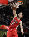 FILE - In this Jan. 29, 2019, file photo, Washington Wizards' Tomas Satoransky (31) dunks against the Cleveland Cavaliers during the second half of an NBA basketball game in Cleveland. Versatile guard Tomas Satoransky says he is headed to the Chicago Bulls. A person familiar with the deal tells The Associated Press the Bulls are acquiring Satoransky in a sign-and-trade that sends draft pick compensation to the Wizards. (AP Photo/Tony Dejak, File)