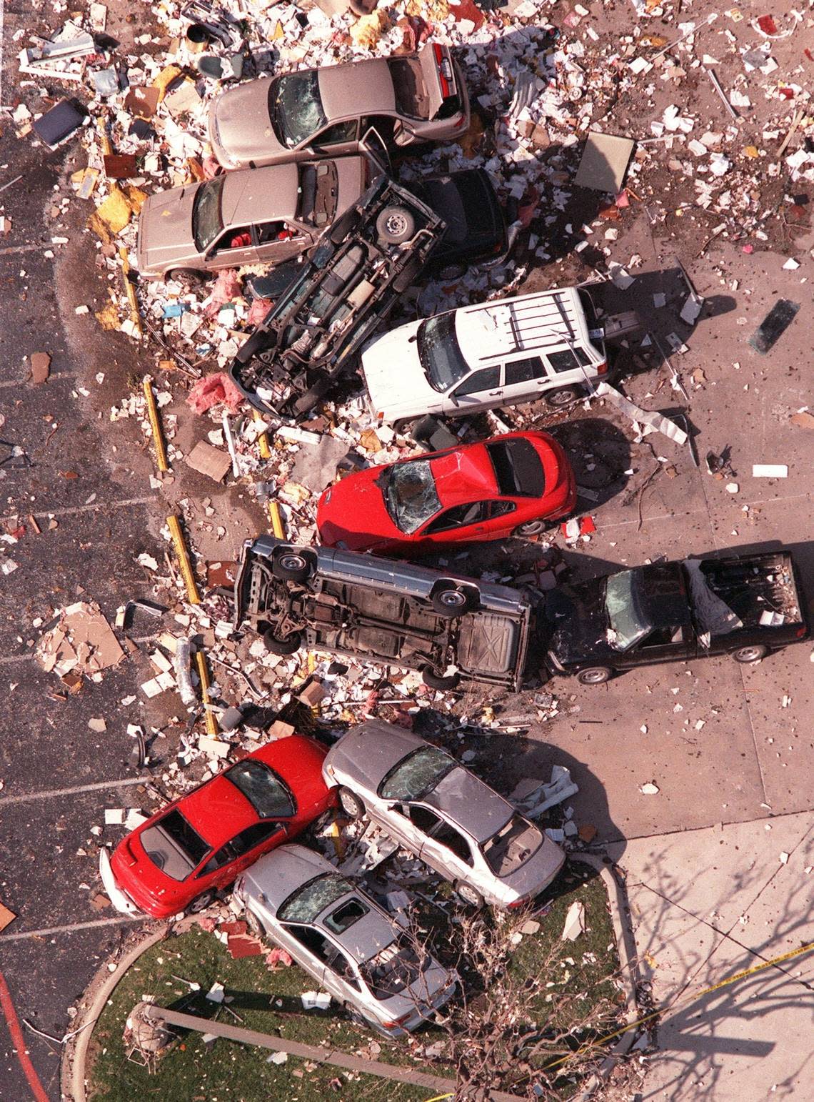 Cars were tumbled in debris outside the Cash America building on West Seventh Street in Fort Worth on the day after the March 28, 2000, tornado.
