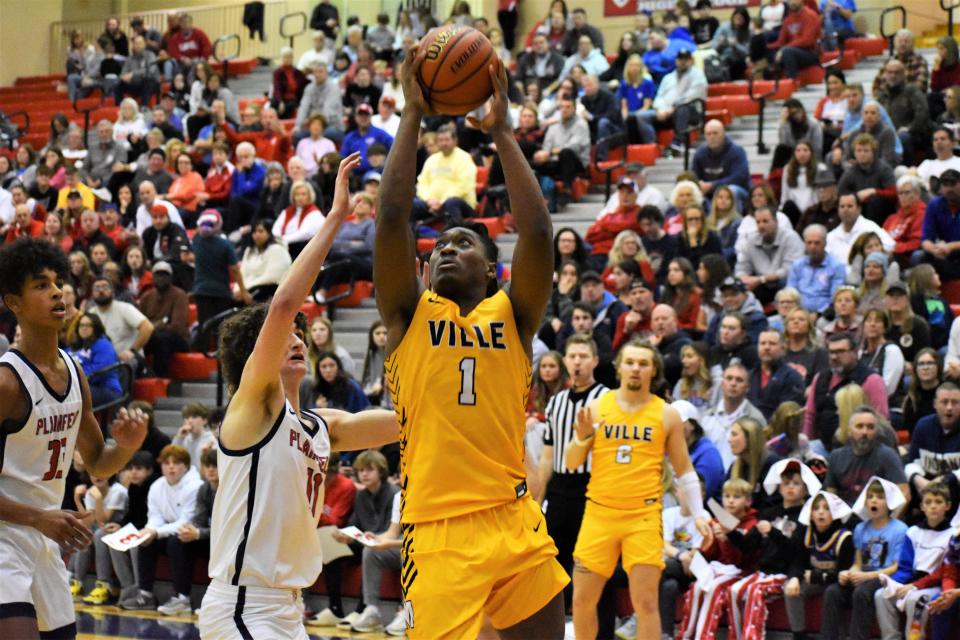 Mooresville's Nick Patterson (1) rises for a layup attempt during the Pioneers' matchup with Plainfield on Jan. 21, 2023.