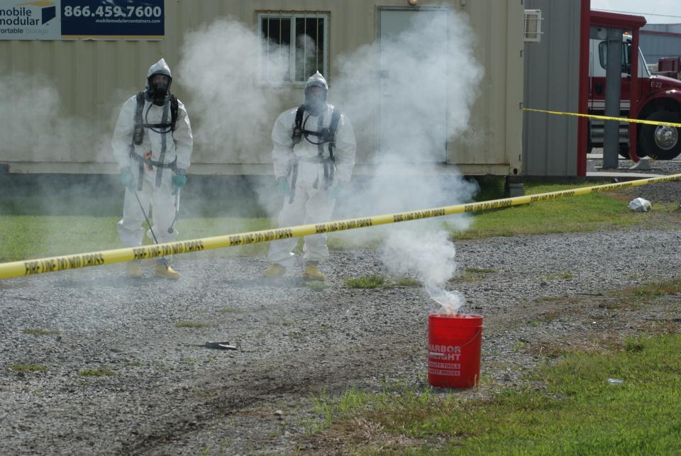 Firefighters Alex Pierce, 27, of Cut Off, and Grady Fagan, 30, dispose of lithium during a meth lab cleanup training course Friday, Aug. 19, 2022, at the Golden Meadow Fire Station.