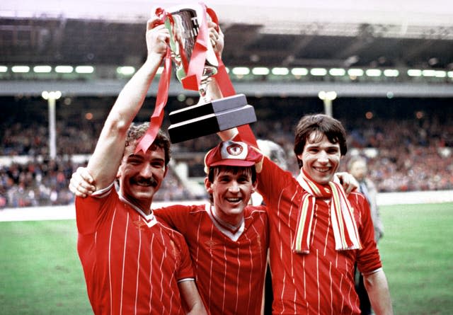 Graeme Souness (left), Kenny Dalglish and Alan Hansen celebrate with the Milk Cup