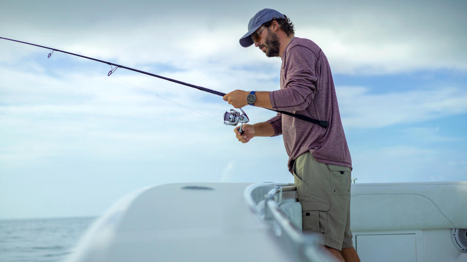 Fisherman wearing Garmin quatix 7 Pro marine smartwatch