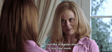 Amy Poehler in character as Mrs. George wearing a pink top with a necklace, caption says "I'm not like a regular mom. I'm a cool mom."
