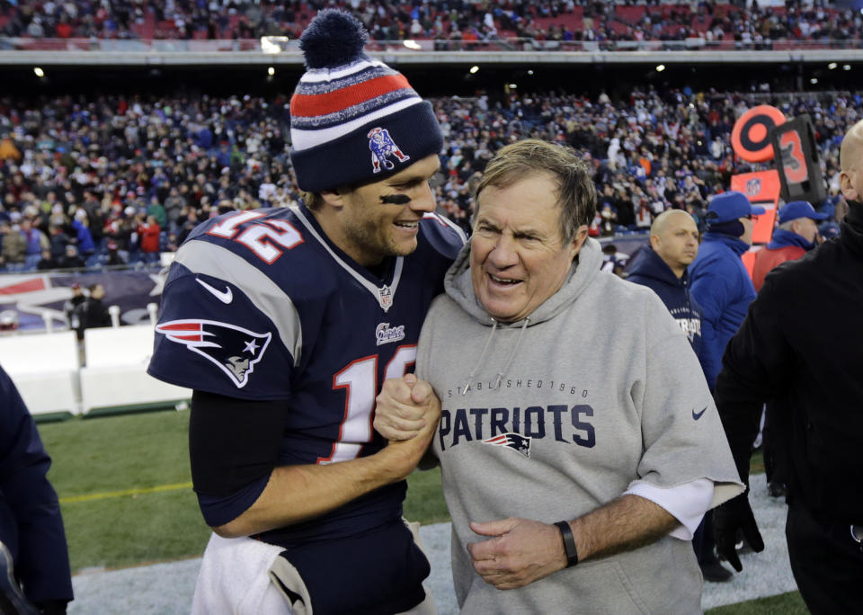 FILE - New England Patriots quarterback Tom Brady, left, celebrates with head coach Bill Belichick after defeating the Miami Dolphins 41-13 in an NFL football game Sunday, Dec. 14, 2014, in Foxborough, Mass. Six-time NFL champion Bill Belichick has agreed to part ways as the coach of the New England Patriots on Thursday, Jan. 11, 2024, bringing an end to his 24-year tenure as the architect of the most decorated dynasty of the league’s Super Bowl era, a source told the Associated Press on the condition of anonymity because it has not yet been announced. (AP Photo/Charles Krupa, File)