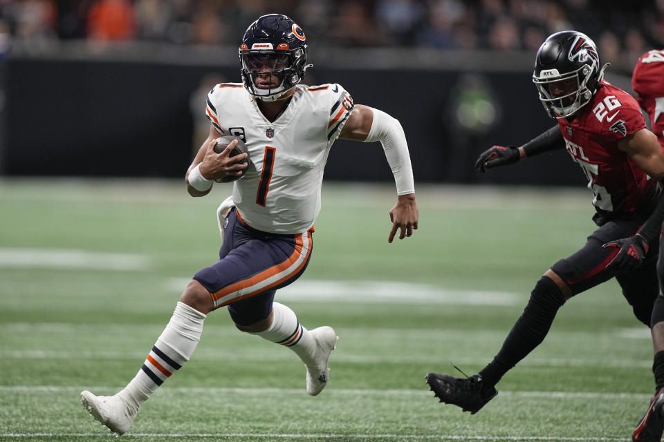 Atlanta Falcons quarterback Marcus Mariota (1) runs out of the pocket against the Atlanta Falcons during the first half of an NFL football game, Sunday, Nov. 20, 2022, in Atlanta. (AP Photo/Brynn Anderson)