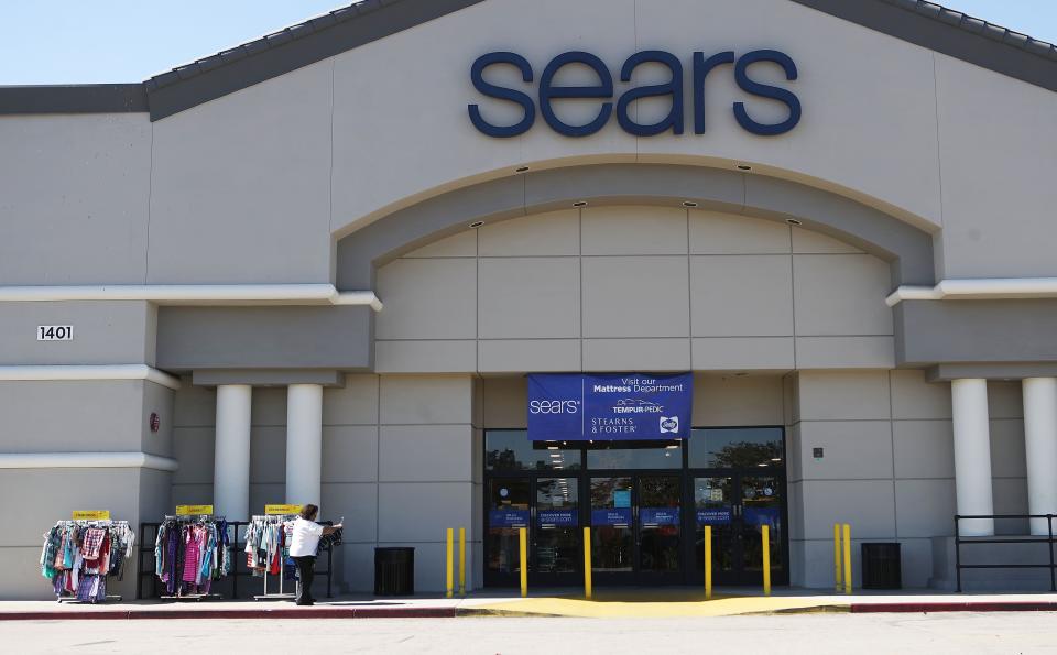 MONTEBELLO, CA - OCTOBER 15:  A woman shops for clearance items in front of a Sears store on October 15, 2018 in Montebello, California. The iconic American retailer has filed for Chapter 11 protection from creditors early on Monday, listing more than $10 billion in debts and more than $1 billion in assets. Sears and its Kmart stores plan to stay in business for now, with help from $600 million in new loans. (Photo by Mario Tama/Getty Images) ORG XMIT: 775243221 ORIG FILE ID: 1052210808