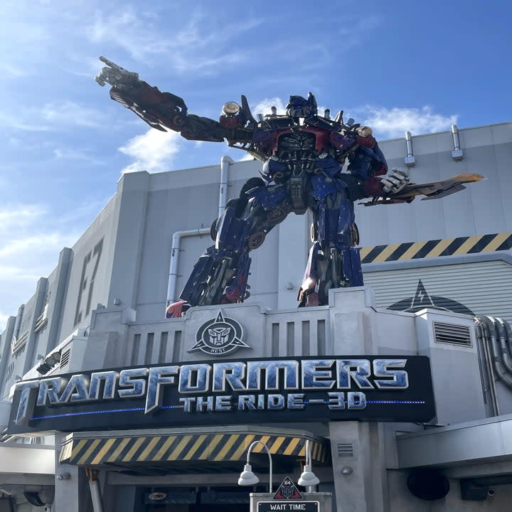 A photo of a incredibly large Transformer on top of a building