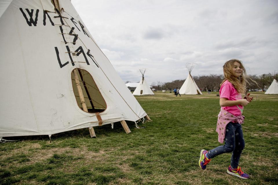 A group protesting the Dakota Access oil pipeline has set up teepees on the National Mall near the Washington Monument in Washington, Tuesday, March 7, 2017. A federal judge declined to temporarily stop construction of the final section of the disputed Dakota Access oil pipeline, clearing the way for oil to flow as soon as next week. (AP Photo/Andrew Harnik)