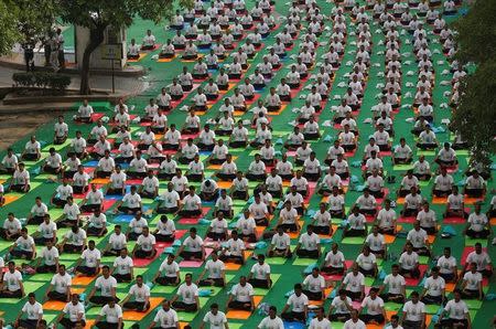 Participants perform yoga on International Yoga Day in New Delhi, June 21, 2017. REUTERS/Adnan Abidi